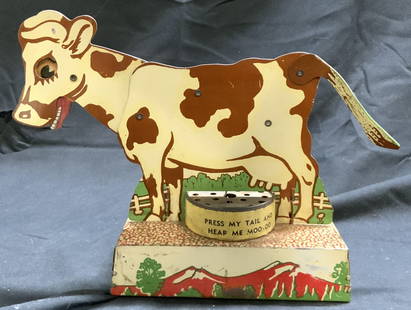 Vtg Tin Colorful Mooing Cow Mechanical Toy: Mechanical cow toy is vintage circa 1930’s. Toy is tin & has colorful detail and form of a cow standing on a pedestal. Piece has articulated tail, mouth and head. Mooing mechanism does not function.