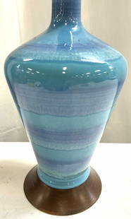 Aqua Porcelain Lamp W Wooden Base: Lamp is aqua toned. Piece appears to be porcelain possibly ceramic. Lamp has brown toned base, appears to be wooden possibly veneer. Lamp measures approximately 17.5 inches tall 6 inches wide. Lamp, p