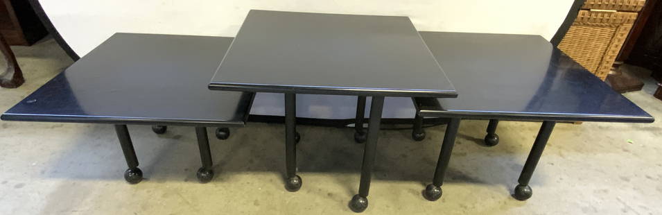 Set 3 Side Tables W Wheels Black: Lot includes 3 tables. Each are black toned & appear to be composite. Tables have 4 legs each with wheels at ends. Largest table measures approximately 17 inches tall 21.5 inches square. Tables, side