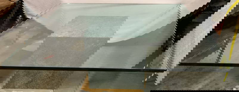 Marble Base Glass Top Coffee Table: Coffee table has green toned marble base. Base and glass is significantly weighted. Piece has square form thick glass top. Measures approximately 44 inches square 16.5 inches tall. Coffee table, glass