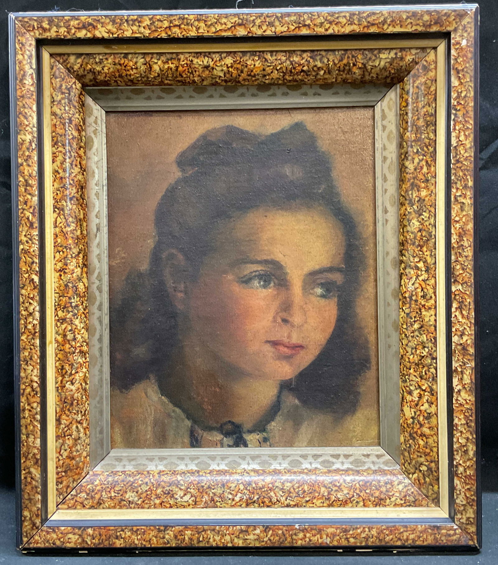 Framed Portrait of a Girl Oil Painting: Framed oil on board painting. Portrait of girl with ribbon in hair. Marbled wood frame. Not examined out of frame. Frame measures approx 14 x 12 inches, window approx 9.75 x 7.75 inches. Some wear con