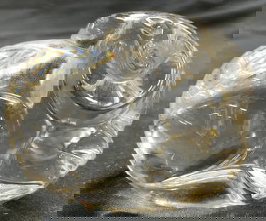 STEUBEN Crystal Art Gls Ram Paperweight: Underside is signed STEUBEN. Paperweight is crystal. Piece depicts a seated ram figure. Art glass ram form paperweight signed STEUBEN. Piece measures approx 2.25 inches deep 1.75 inches tall 1.5 inche