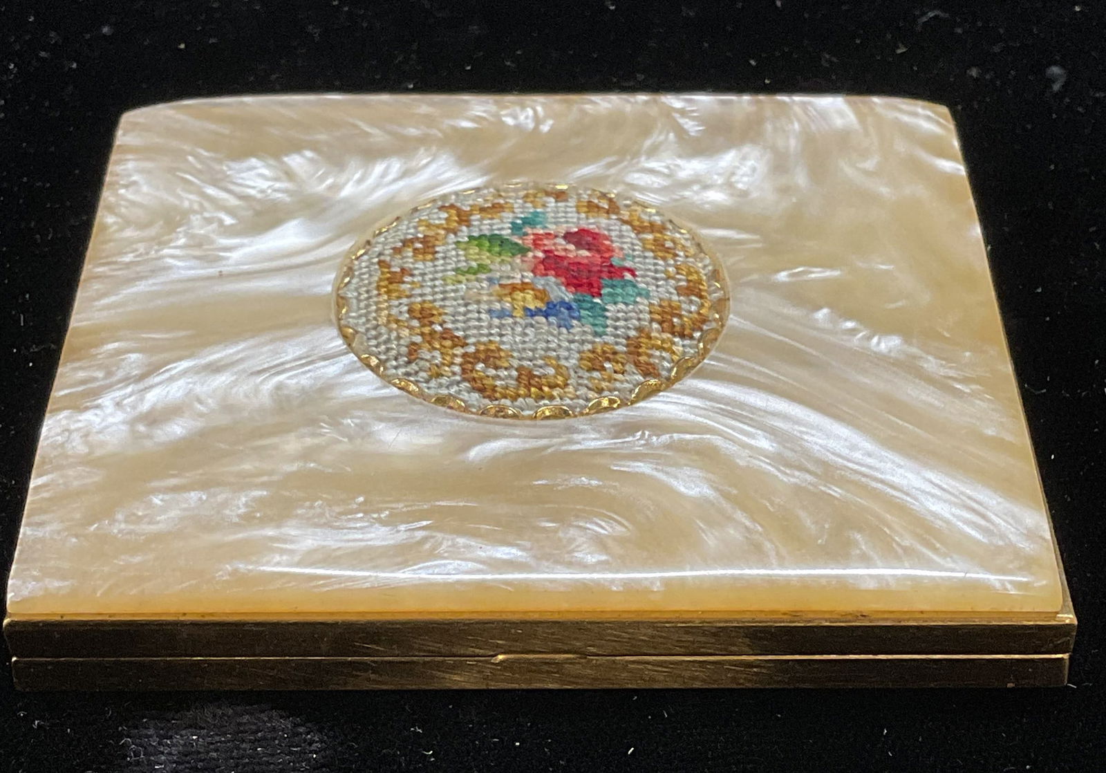 Vintage Schildkraut Petitpoint Compact Mirror: Vintage Schildkraut compact mirror. Gold tone with faux lucite mother of pearl and handmade Petitpoint decoration on cover. Signed on label. Measures approx 2.75 x 2.25 inches. Inventory from Manhatta