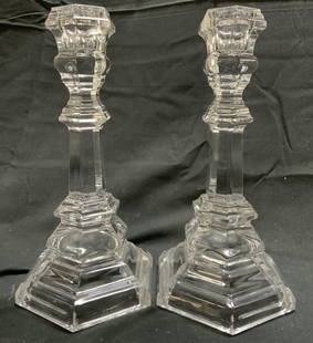 TIFFANY & CO Pair Crystal Candlesticks: Undersides are marked TIFFANY & CO. Lot includes 2 candlesticks. EACH candlestick is crystal. Bases of each have hexagonal forms. Candlesticks each measure approximately 8 inches tall 4.25 inches wide
