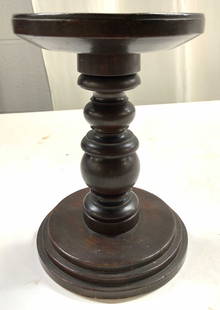 Antq Hand Turned Treen Candle Stand 19th C: Candle stand is antique. Underside has tag which reads HAND TURNED FRROM MAHOGANY DURING THE 1ST HALF OF THE 19TH CENTURY. Candle stand is brown toned. Piece has circular form base and top surface. Pi