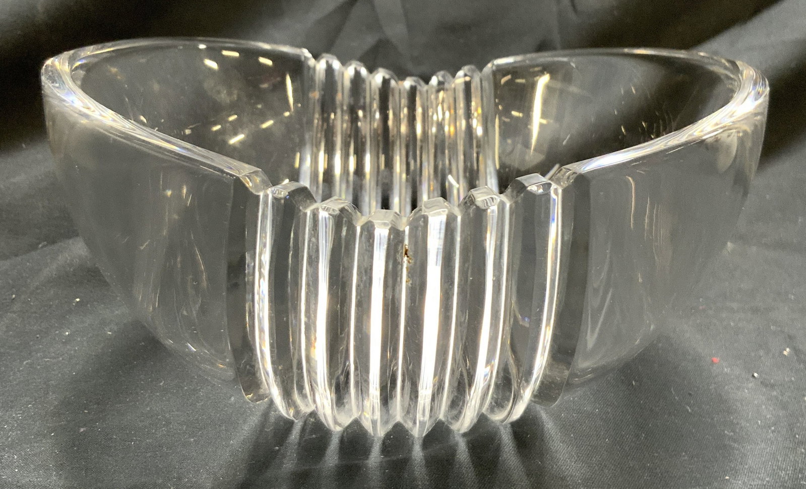 TIFFANY & CO Signed Fluted Crystal Bowl: Bowl is signed TIFFANY & CO. Piece is crystal. Bowl has fluted area. Two areas on rim are toothed. Bowl measures approximately 6.25 inches wide 3.25 inches tall. Bowl, crystal bowl, Tiffany & co bowl,