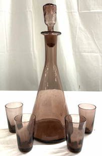 Set 5 Art Glass Decanter & Glasses: Lot includes 1 decanter with stopper & 4 matching glasses. Each are amethyst toned. Decanter expands towards base. Vessel has narrow neck, rim leans outward. Decanter measures approximately 10.25 inch
