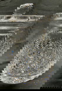 WATERFORD CRYSTAL Biscuit Barrel W Lid: Underside is marked for WATERFORD. Biscuit barrel is cut crystal. Piece includes lid. Vessel has geometric pattern detail. Lid has handle. Piece measures approximately 7 inches tall 5 inches wide. Ves