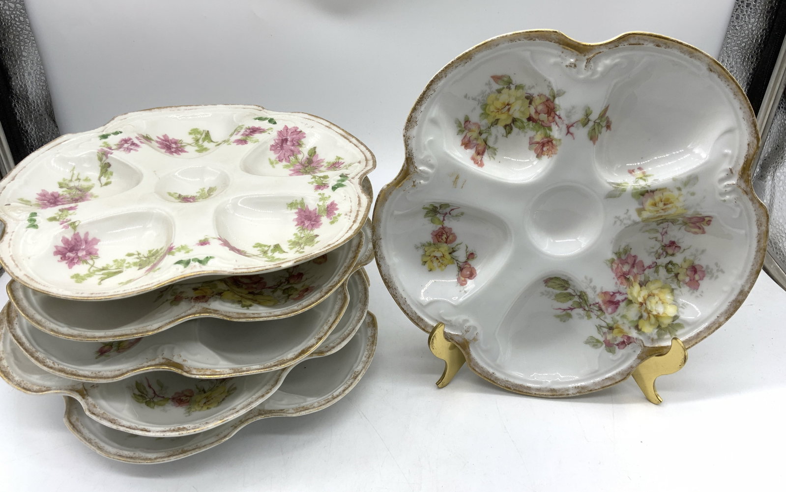 6 LIMOGES Porcelain Floral Oyster Plates FRANCE: 6 LIMOGES Porcelain Floral Oyster Plates FRANCE 6 oyster plates depicting an adorned hand-painted pink & yellow floral design. Rims of oyster plates have a gold rim. Signed & marked on underside. LIMO