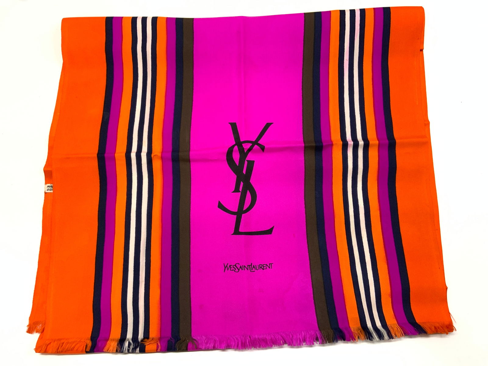 Yves Saint Laurent Silk Pink Striped Scarf: Yves Saint Laurent Silk Pink Striped Scarf Silk scarf featuring a vibrant striped pattern in orange, pink, navy & white. Scarf has orange borders & YVES SAINT LAURENT text. Surface wear consistent to