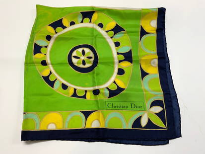 Christian Dior Green Geometric Silk Scarf: Christian Dior Green Geometric Silk Scarf Silk scarf featuring a vibrant geometric pattern with a navy border. Colors including green, yellow & navy. Christian Dior text on the bottom right. Signed &