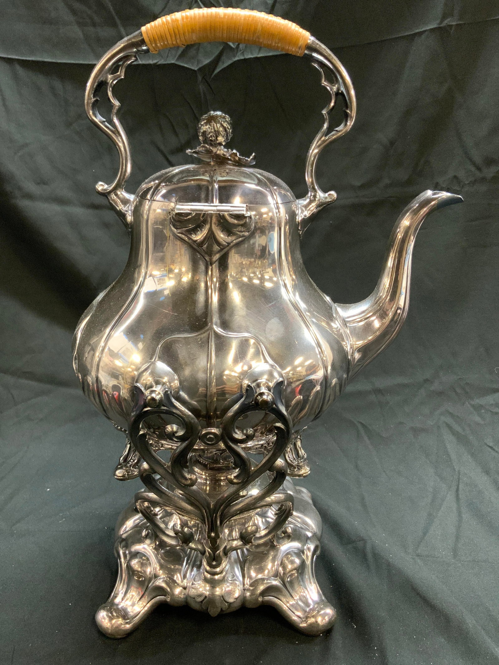 JAMES DIXON & SONS Silv Pl Boulotte Pot W Warmer: Underside is inscribed JAMES DIXON & SONS. Teapot and stand are silver plated. Teapot has feet, lid, & handle. Teapot and stand are silver plated. Stand is footed and has scrolled structures. Tilting 