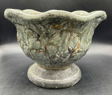 Vintage Glazed Floral Motif Pottery Planter: Vintage Glazed Floral Motif Pottery Planter. Pedestal planter with a scalloped rim. Raised floral designs to the sides. Thick walled and weighty. Measures approx. 8.5H x 12W in. Pitting, crazing, chip