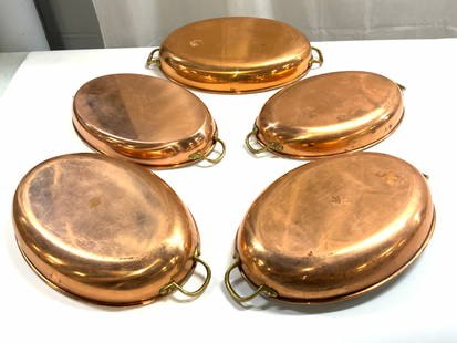 COPRAL Set 5 Copper Serving Dishes PORTUGAL: Undersides of some dishes are inscribed COPRAL MADE IN PORTUGAL. Lot includes 5 dishes. Each are cooper with brass handles and silver toned interiors. Dishes each have oval forms. Outer rims have lips