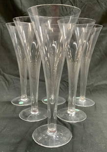 TIFFANY & CO Set 6 Crystal Champagne Flutes: Tags read TIFFANY & CO MADE IN HUNGARY. Lot includes 6 champagne flutes. Each are crystal. Flutes taper inward towards bases. Each have circular form bases, each measures approximately 9.25 inches tal