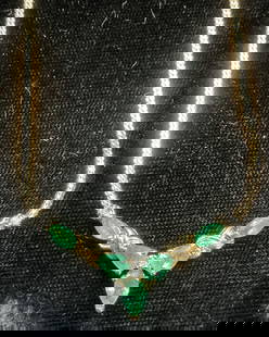 Signed HN 14k Gold & Emerald Necklace: Signed 14k gold necklace with emerald semiprecious stones and colorless precious stone accents. Possibly diamond. Signed HM. Marked 14k. Drop length approx 7.5 inches, total weight 4.8 grams. Includes