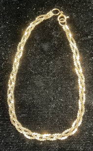 Vintage 14K Gold Braided Chain Bracelet: Vintage 14k gold bracelet with three strand braided chain. Measures approx 6.25 inches long. Total weight 1.4 dwt. Marked 14k on clasp. Chain tests for gold using acid test. Clasp needs repair. Some w