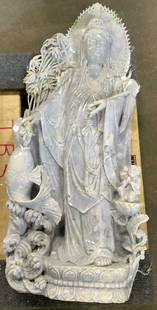 Dushan Green Carved Guan Yin Jade Sculpture 34in: Carved Guan Yin Jade Sculpture. Figure holding koi fish. Child depicted in lower right side corner, in additions to foliage. The stone is a dushan green and earth toned hues throughout. Appears to be