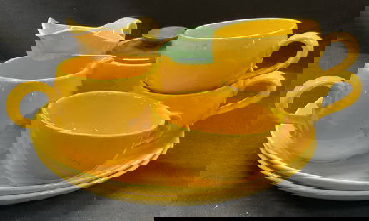 Lot 8 Homer Laughlin Santa Anita Ceramic Dishware: Lot 8 Homer Laughlin Santa Anita ceramic dish ware. Lot includes 2 yellow dinner plates, 2 white and yellow small pitchers, 3 yellow mugs, 1 yellow and green cream sugar holder. 10.5 inches. Some surf