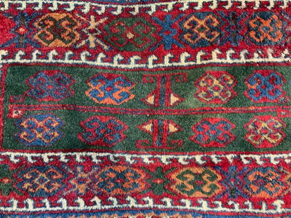 Vintage Handmade Persian Wool Area Rug: Rug is handmade and wool. Piece appears to be vintage possibly antique. Rug has intricate multi toned floral motif detail. Rug short sand toned edges 36 inches long 24 inches wide. Rug, carpet, area r