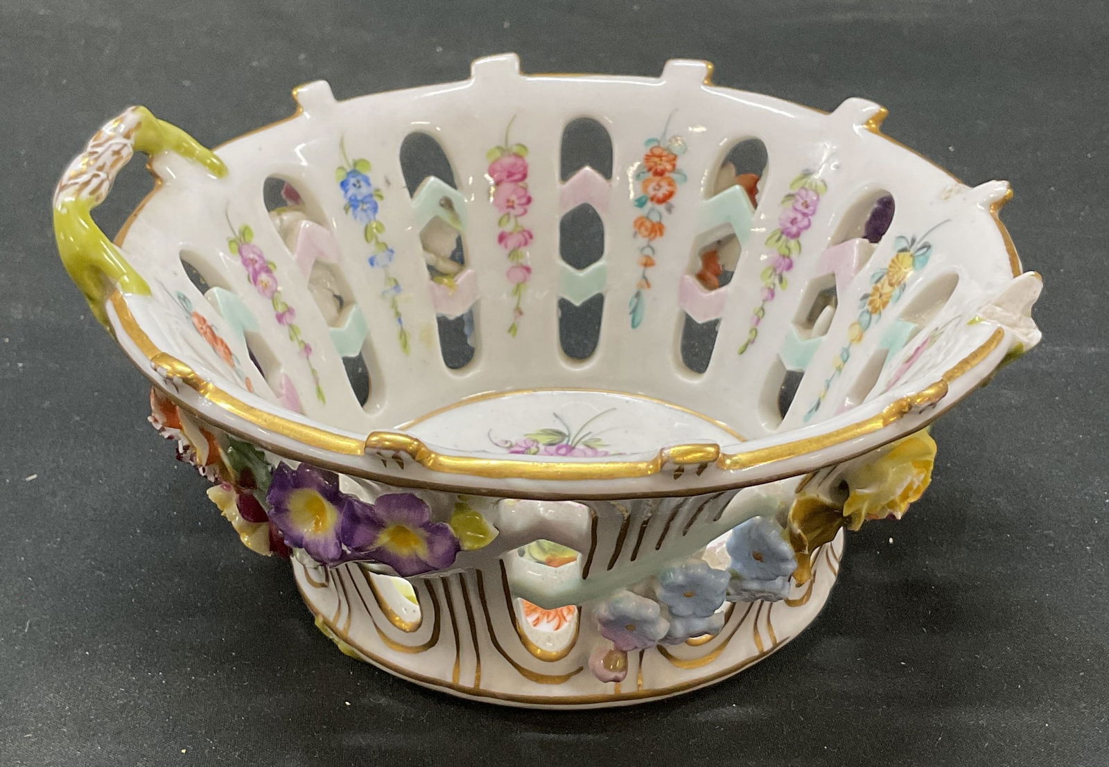 Dresden Ceramic Floral Bowl: Dresden ceramic floral bowl. Signed on underside. Hand painted bowl with exterior protruding floral patterns. Two handles. 6 x 3 inches. Wear including chipping. Ceramic bowl, Dresden ceramics, Tablew