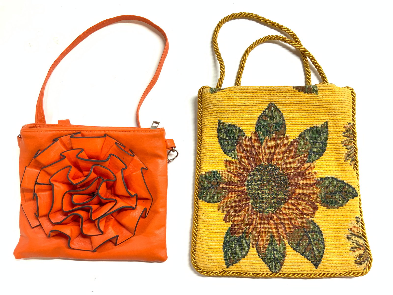 Leather Floral & FRANCESCA G Crossbody Bags: Tag on interior of fabric bag reads FRANCESCA G. Piece is yellow with goldenrod toned corded strap. Bag has multi toned floral and leaf detail. Leather bag is orange toned and leather with floral deta