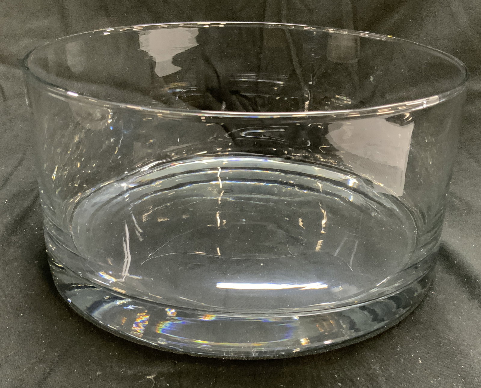 Clear Glass Bowl W Thick Walled base: Bowl is glass. Piece has thick walled base. Bowl has circular form. Clear glass bowl. Piece measures approximately 9.5 inches diameter 4.75 inches tall. Bowl, glass bowl, thick walled base glass bowl,