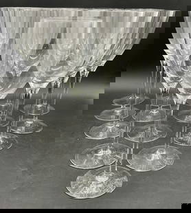 Lot 14 Crystal Stemware Wine Glasses: Lot 14 Crystal Stemware Wine Glasses. Thirteen are the same height, one is shorter. The talker glasses measure approx. 9.75H x 3.5W in. Surface wear consistent with age, use, and exposure. Chipping pr