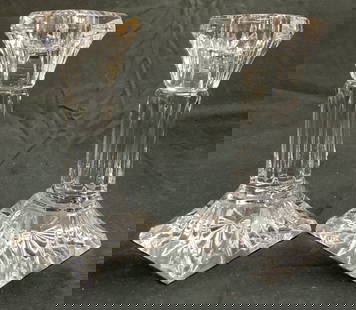 WATERFORD Crystal Pr Column Candlesticks: Bases read WATERFORD. Lot includes 2 candlesticks. Each are crystal. Candlesticks have column forms. Each have square form bases. Candlesticks measure approximately 6 inches tall 3 inches square at ba