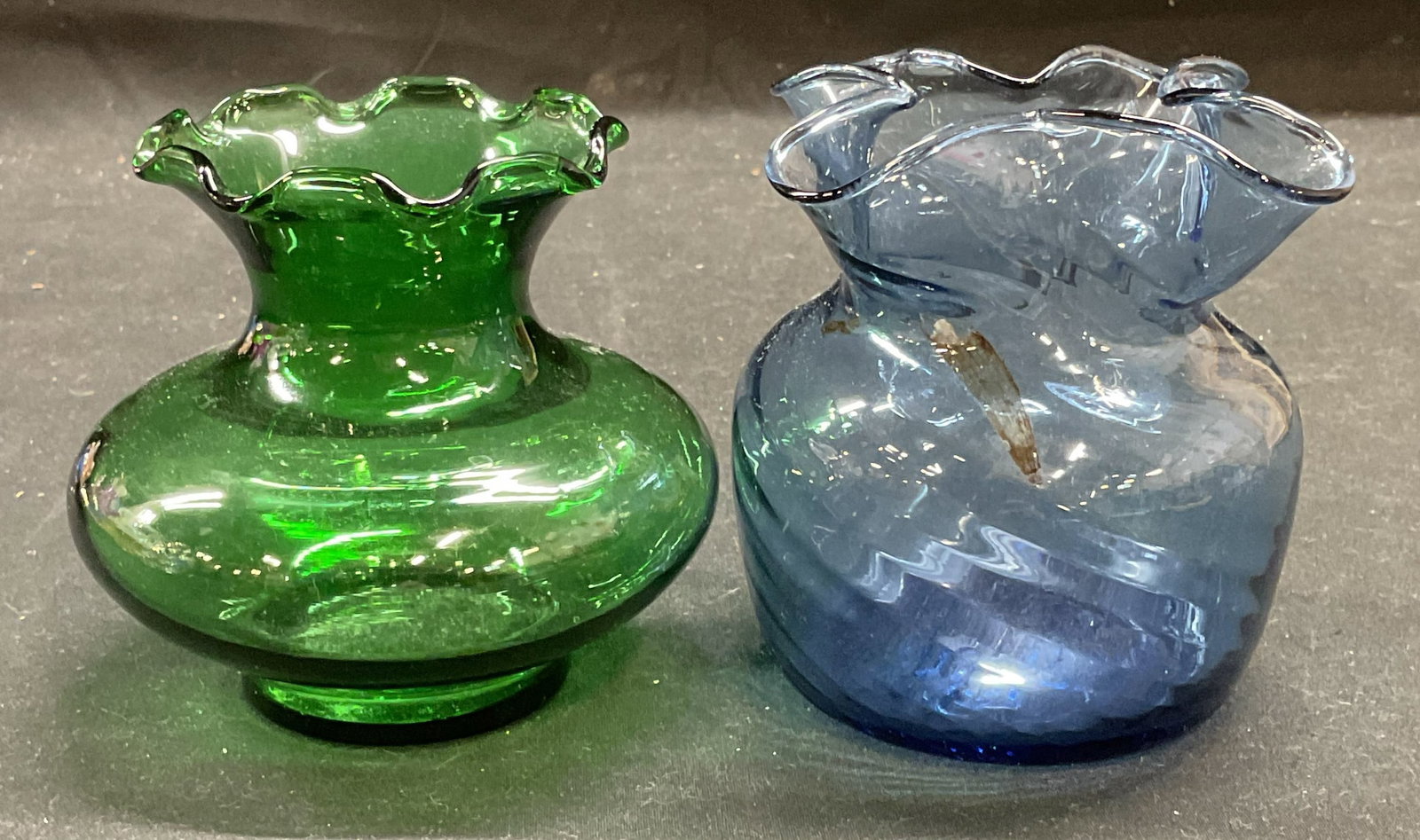 Lot 2 Green & Blue Art Glass Handkerchief Vases: Lot of 2 green and blue toned art glass vases with handkerchief rims. Larger piece measures approx 3.25 x 3.75 inches. Some wear including scratching observed. Art glass, art glass vase, glass vase, h