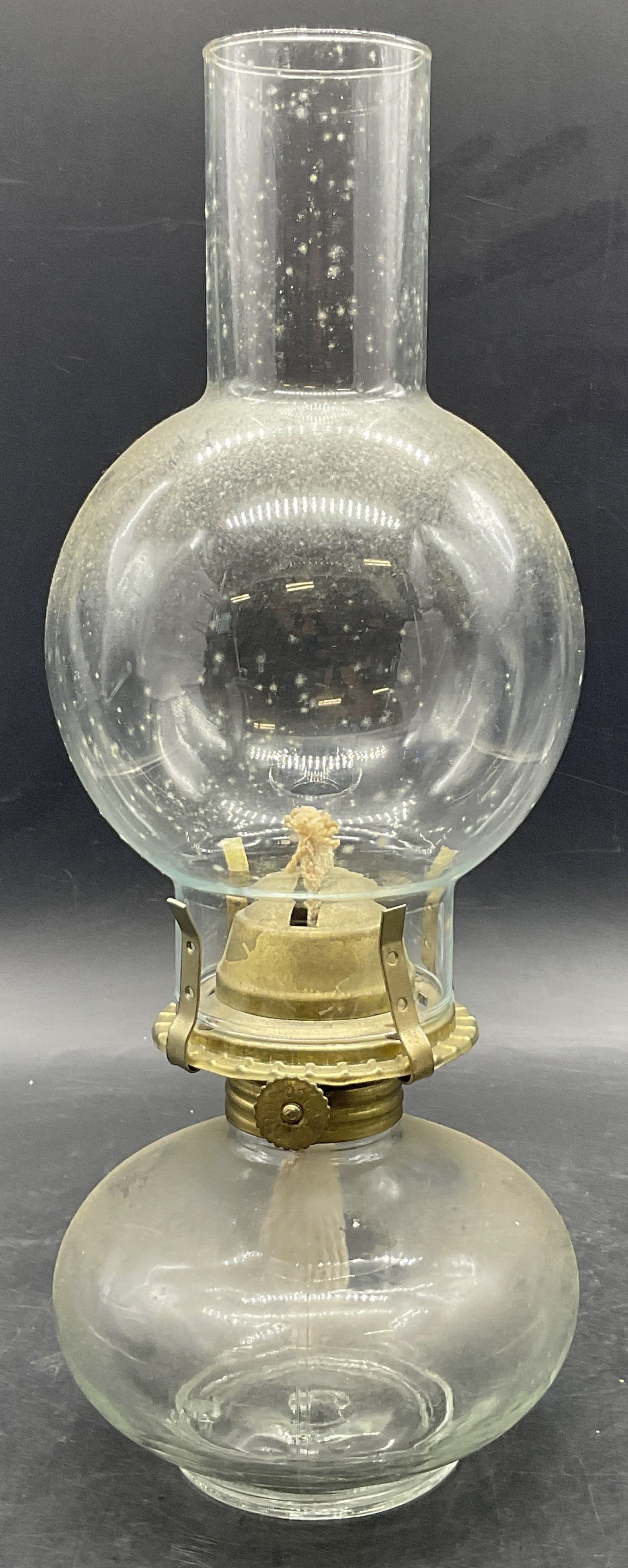 ARDA MEXICO Vintage Glass & Metal Oil Lamp: Vintage Glass & Metal Oil Lamp. Measures approx. 13H x 4.5W in. Hardware reads ARDA MEXICO. Not tested for function. Top piece is not attached. Residue, discoloration, and surface wear present. home d