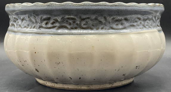 Blue & White Ribbed Pottery Planter: Blue & White Ribbed Pottery Planter. Raised details to the piece. Measures approx. 5.75H x 12W in. Drilled drainage hole. Partial sticker to underside. Detritus to interior. Surface wear, pitting, cra