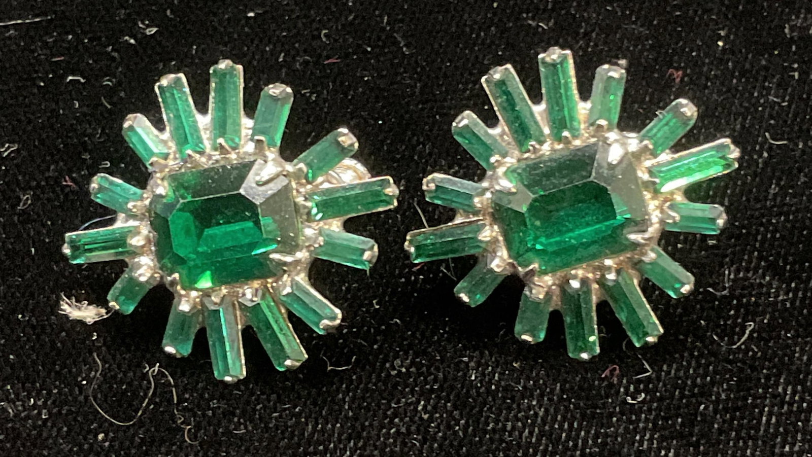 Vintage Art Deco Style Green Crystal Earrings: Vintage art deco style silver tone green crystal earrings. Geometric design. Measure approx 1 inches wide. Some wear including scratching observed. Jewelry, estate jewelry, costume jewelry, cocktail j
