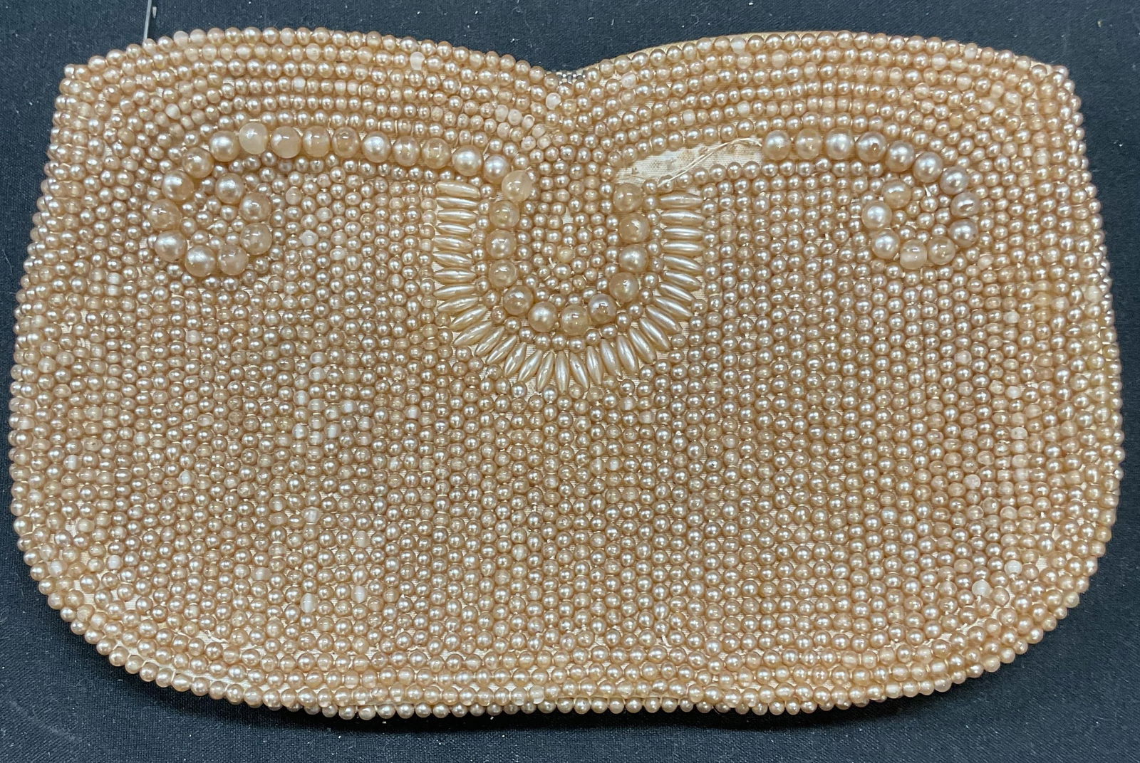 Vtg Magid Faux Pearl Beaded Clutch, Japan: Vintage Magic faux pearl beaded clutch. Signed. Measures approx 7 x 4.5 inches. Some loss to beading, pealing to pearls, and discoloration. Magid, Magid clutch, faux pearl clutch, vintage handbag, des