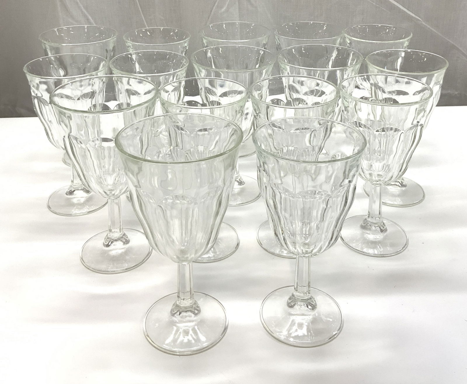 16 Thick Textured Goblet Style Drinking Glasses: 16 Thick Textured Goblet Style Drinking Glasses Goblet drinking glasses that has a distinctive textured design. They have a stem & a circular base. Surface wear consistent to age, use & exposure. Meas