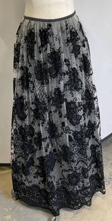 Armani Black Polyester Maxi Floral Skirt: Armani collection black polyester maxi floral skirt. Outer lining in mesh with floral designs. Fully lined. 100% polyester. Side zipper and button. Made in Slovakia. Size 8. Some wear consistent with