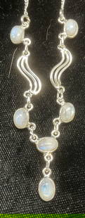 Sterling Silver Moonstone Pendant Necklace: Sterling silver necklace with moonstone cabochon pendants. Drop length approx 9 inches. Marked sterling. Total weight 6.8 grams. Some wear including scratching observed. Jewelry, estate jewelry, fine