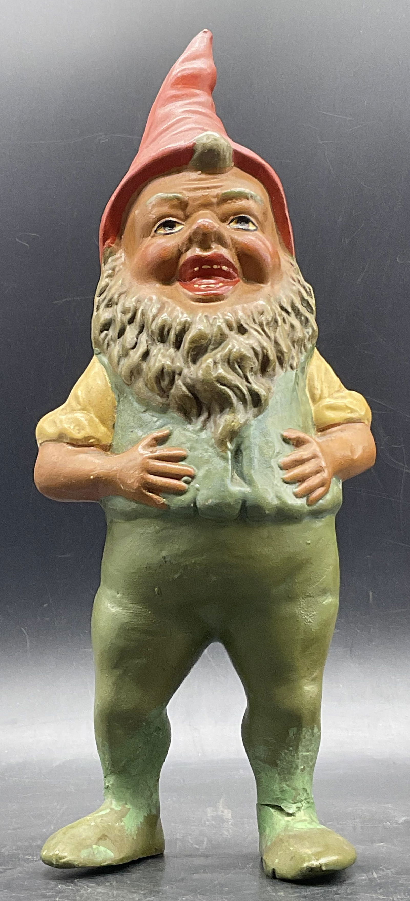 ORIGINAL HEISSNER GERMANY Vintage Ceramic Gnome: ORIGINAL HEISSNER GERMANY Vintage Ceramic Gnome. Painted red, green, yellow, and brown hues. Reverse is marked Germany and the food is marked Germany. Sticker to reverse reads ORIGINAL HEISSNER. Measu