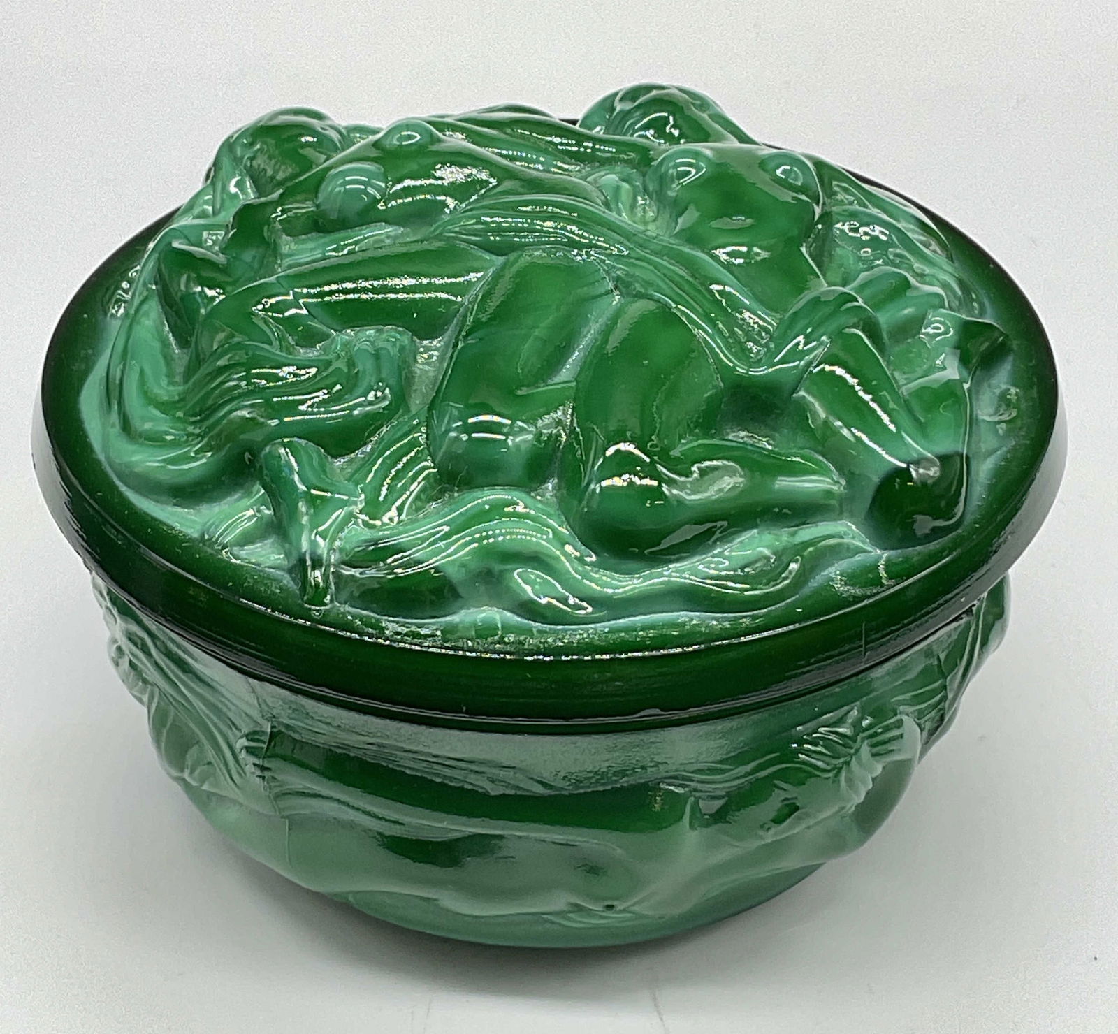 Vntg Art Nouveau Malachite Art Glass Trinket Box: Vintage Art Nouveau Malachite Art Glass Trinket Box. Lidded. Nude and semi nude art nouveau female figures throughout the design. Measures approx. 2H x 3.75W in. Measured at widest point. Seam visible