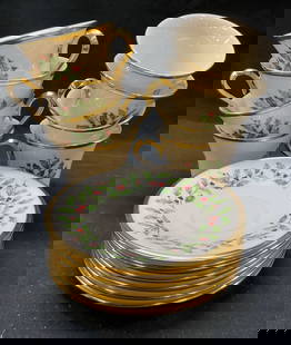 Set 15 Lenox Holiday Porcelain Cups Plates USA: Set 15 Lenox Holiday porcelain cups and plates. Set includes 8 cups and 7 plates. Gold trim, holly berry motif. Made in USA. Plated measures 6 inches. Some surface wear consistent with exposure. Lenox