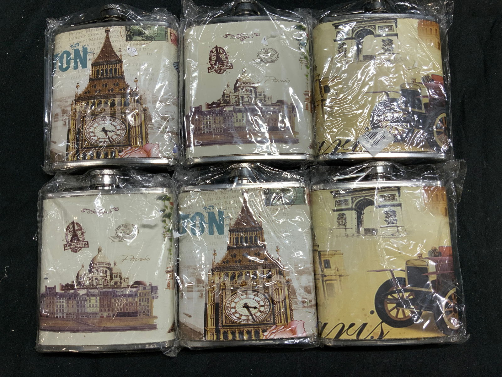 6 London-Themed Stainless Steel Hip Flasks NIP: 6 London-Themed Stainless Steel Hip Flasks NIP Stainless steel flasks depicting London theme imagery. NEW IN PLASTIC. Surface wear consistent to age, use & exposure. Measurements: length 4.8in x width