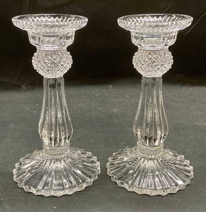 Pair Vtg Clear Cut Glass Candle Holders: Pair of vintage clear cut glass candle holders with diamond and ribbed pattern. Sawtooth edge on base. Measure approx 4.25 x 7.5 inches. Some wear including scratching observed. Candle holders, glass
