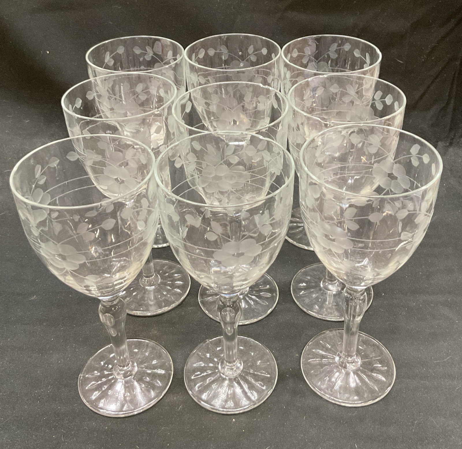 Set 9 Vtg Stemmed Wine Glasses Floral Dot Etched: Set of 9 vintage stemmed wine glasses. Etched floral dot design. 7.5 x 3.25 inches. Some surface wear consistent with exposure, chipping on rim observed. Vintage wine glasses, wine glasses, floral win