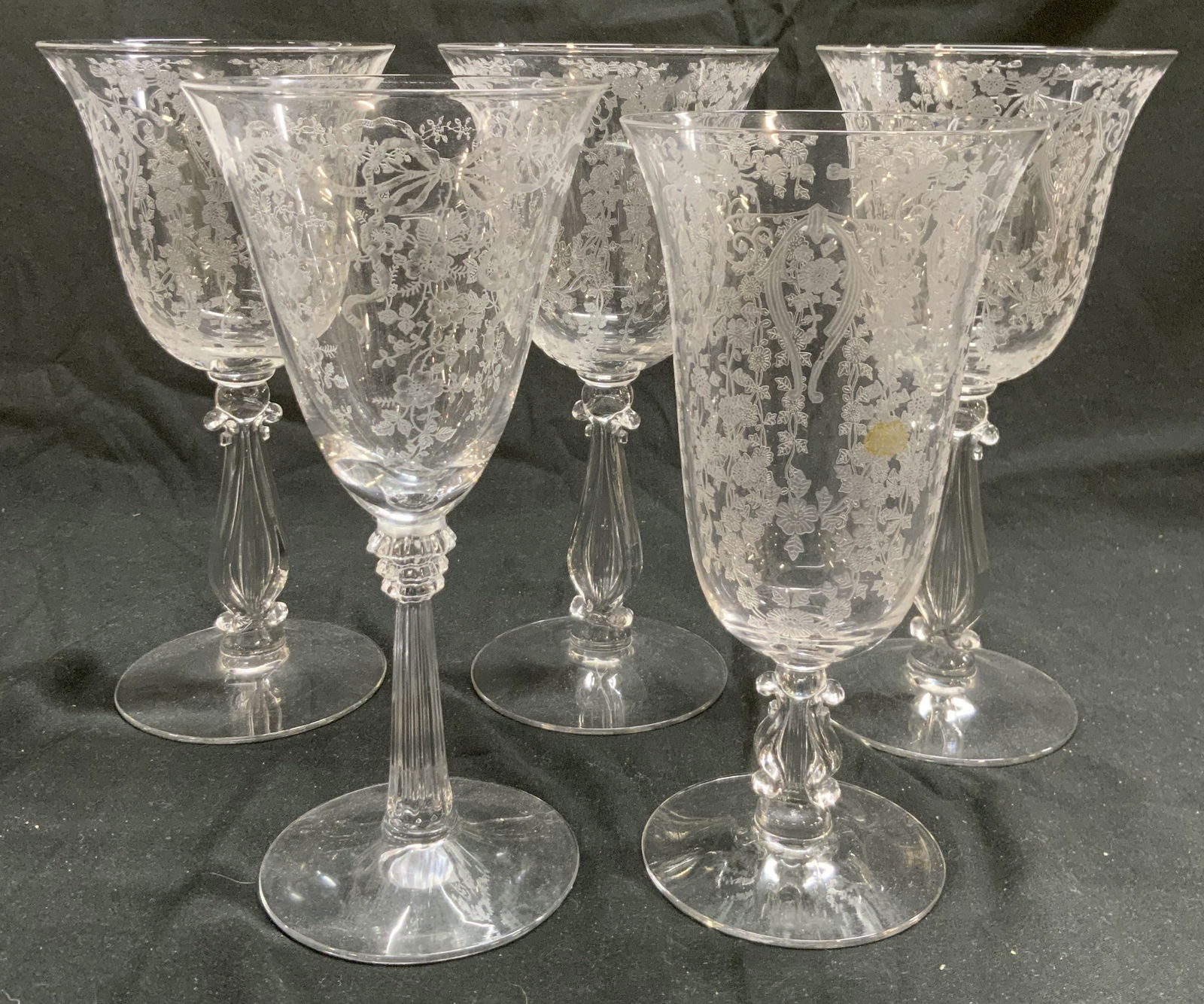 Lot 5 Fostoria Meadow Rose Crystal Goblets: Lot includes 5 goblets. Each appear to be Fostoria Meadow Rose (No apparent markings). Goblets are each crystal. Each piece has frosted floral and leaf relief Detail. Largest piece measures approximat