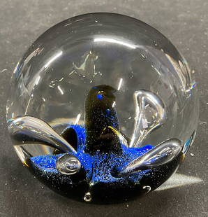 Caithness Flower Art Glass Paperweight, Scotland: Caithness hand blown art glass paperweight. Flower. Blue and black with controlled bubble design. Signed on underside. Made in Scotland. Measures approx 3 inches wide. Some scratching observed. Caithn