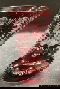 Vintage Cranberry to Clear Etched Glass Vase: Vintage cranberry to clear etched art glass vase. Faceted accents and architecture, bird, and scroll designs. Measures approx 3.75 x 5.75 inches. Some scratching observed. Cranberry glass vase, etched