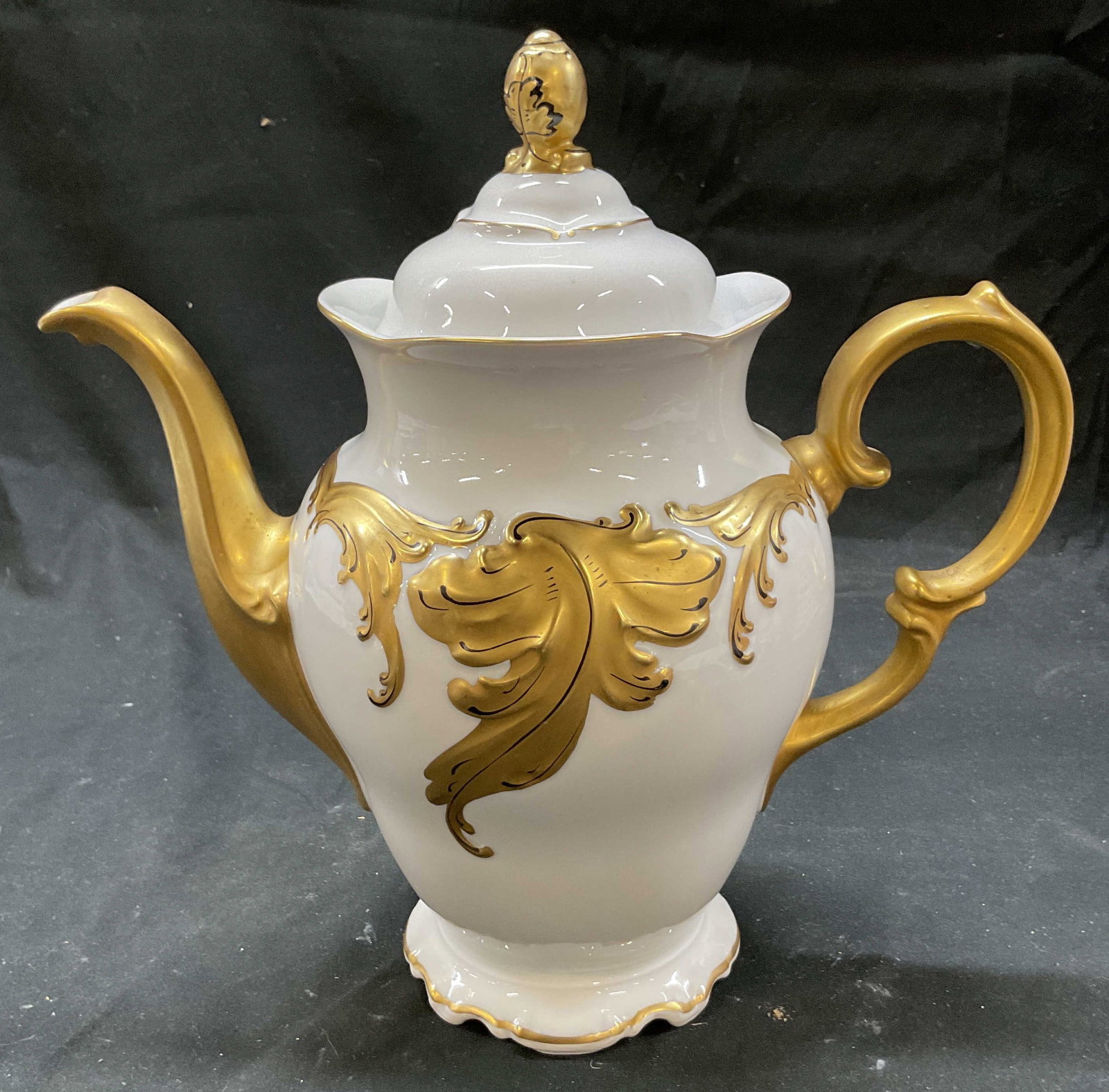 Vtg Walbrzych Gold Leaf Rococo Coffee Pot Poland: Vintage Walbrzych gold leaf Rococo coffee pot. Made in Poland. Coffee pot with lid. White with gold leaf detail. Signed on underside. 10 x 10.5 inches. Some surface wear consistent with exposure. Walb