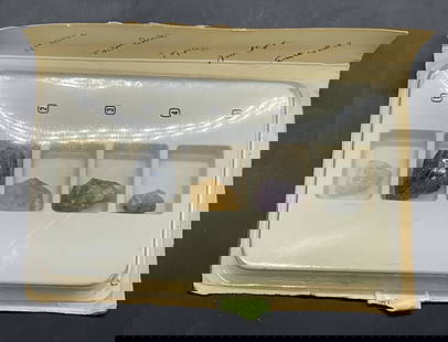 Lot 5 Natural Stone Specimens, Topaz, Amethyst +: Five Natural Stone Specimens. Includes aquamarine, tourmaline, topaz, amethyst, and emerald. The pieces come with their original packaging. The plastic packaging holding the stones measures approx. 5W