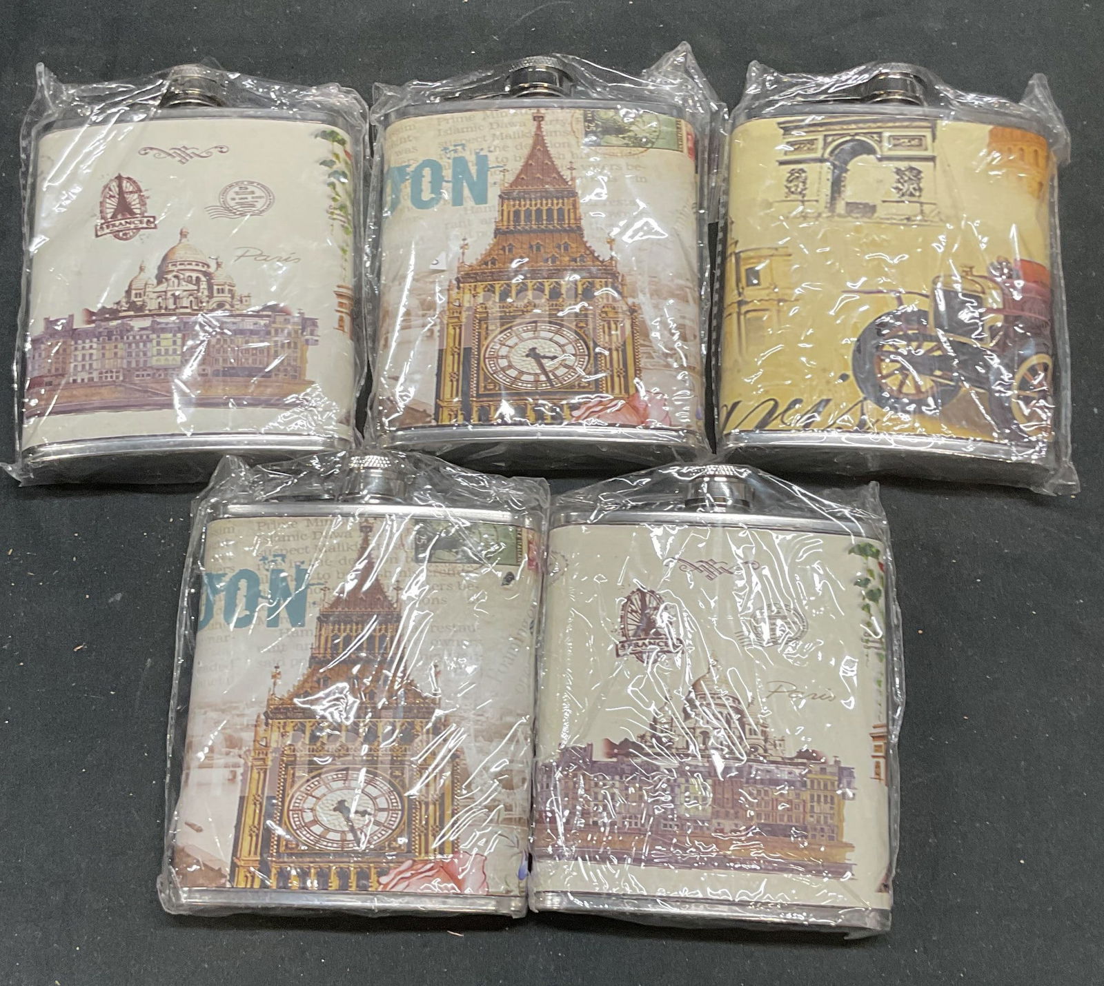 Set 5 Faux Leather Paris 7 Oz Flasks NIP: Set of 5 stainless steel faux leather wrapped Paris and London city motif flasks. 7 ounce size. Measure approx 4.25 inches long. New in packages. Flask, stainless steel flask, faux leather flask, Pari