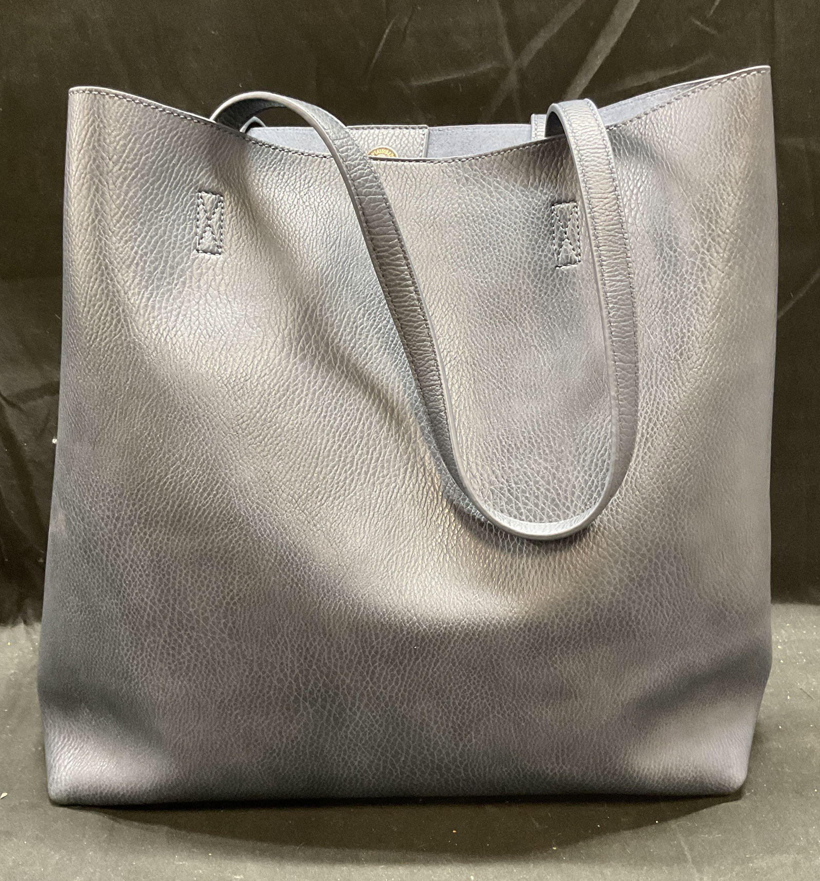 Antik Kraft Blue Faux Leather Tote & Pouch: Antik Kraft blue faux leather tote bag and zippered pouch. Signed on pouch interior. Tote with multiple interior pockets. Tote measures approx 13.5 x 4.5 x 13 inches. Some wear to both pieces includin